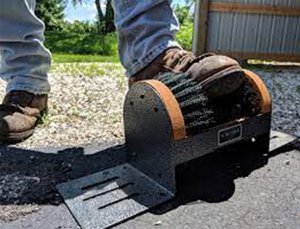 A Scrusher being used to clean boots